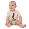 Baby wearing organic cotton bodysuit with Minecraft Enderman design, smiling while sitting on the floor.