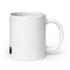 White glossy ceramic mug with Minecraft Enderman design carrying a block, perfect for gamers and fans of the iconic game.