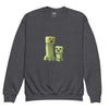 Youth crewneck sweatshirt with Minecraft Creeper design in charcoal gray, made of soft cotton-polyester blend for young gamers.